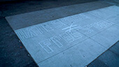 Still image of Sidewalk graffiti, 'Hate Speech does not equal free speech.'