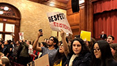 Still image of Protest sign, 'Respect Existence.'