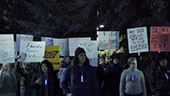 Still image of Protest signs, 'Silence is golden...'